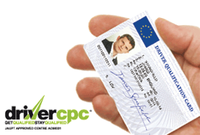 Image shows Driver Qualification Card in a drivers Hand